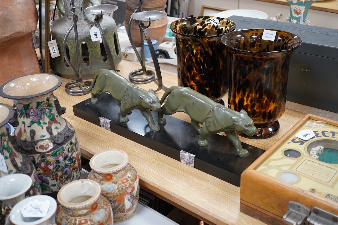 An Art Deco patinated spelter and marble figure of panthers, signed T. Cartier, 70cm